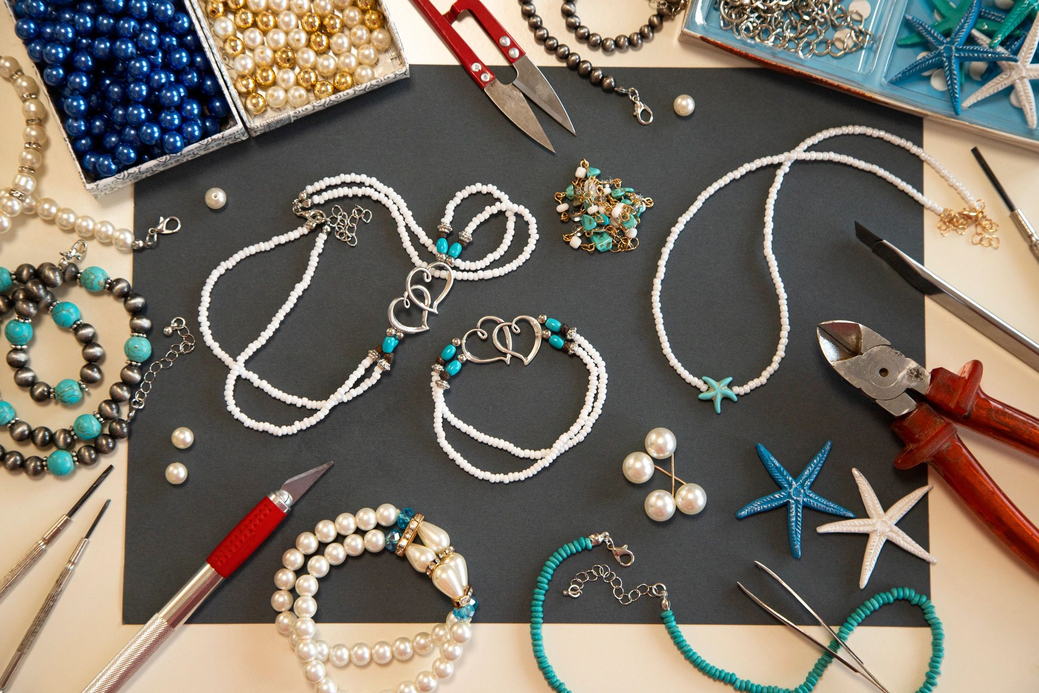 Handmade jewellery arranged on a surface