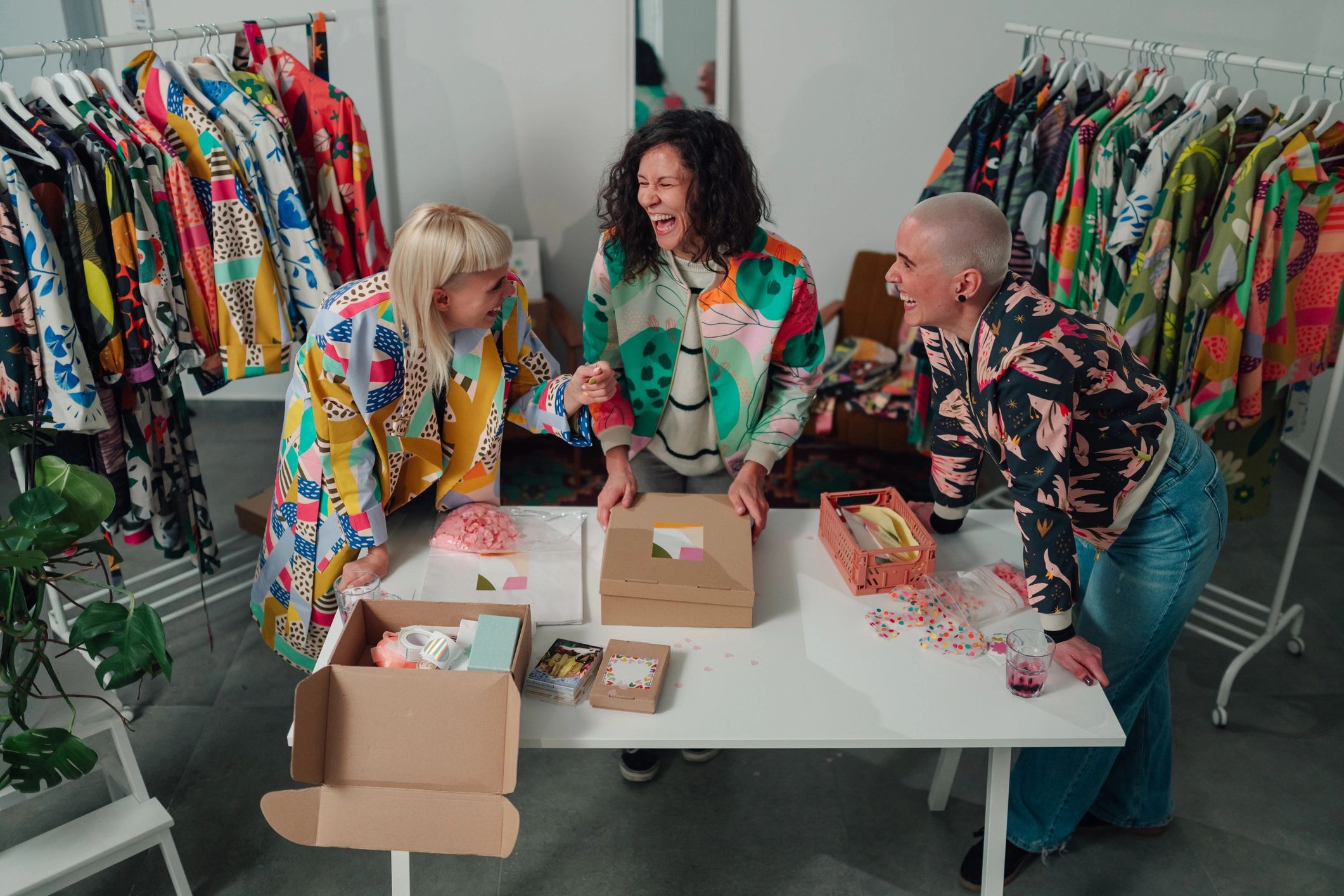 Small business team packing fashion orders for shipping